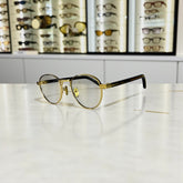 Lunettes de Vue Femme – Prada Round Gold & Black