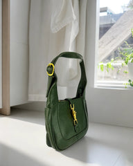 Sac vert à boucle dorée