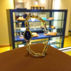 Montre Dorée Femme – Cadran Ovale Bleu Nuit